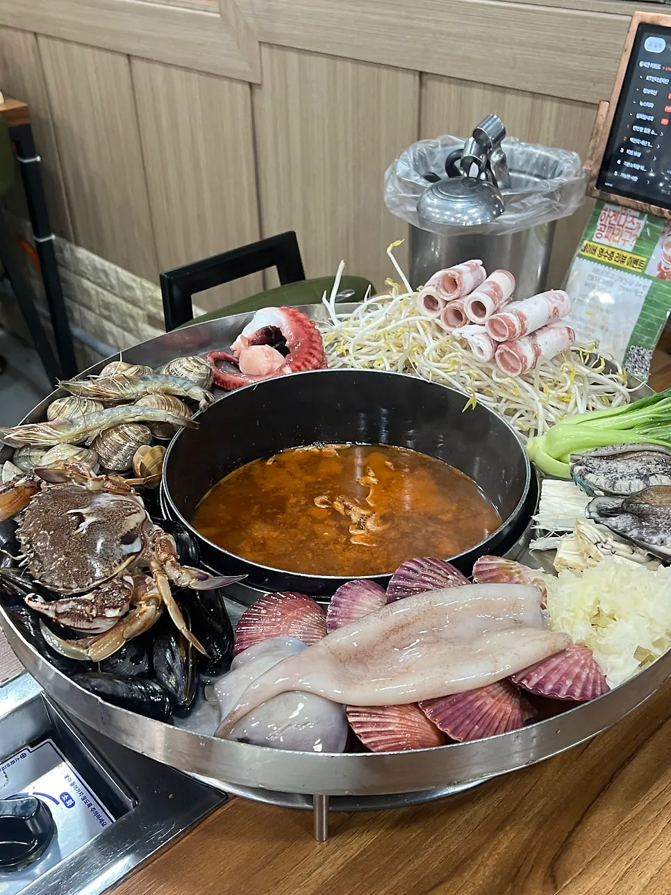 Noodles lifted up with thick broth clinging to them
