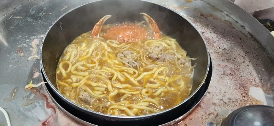 Beef and bean sprouts added after the seafood