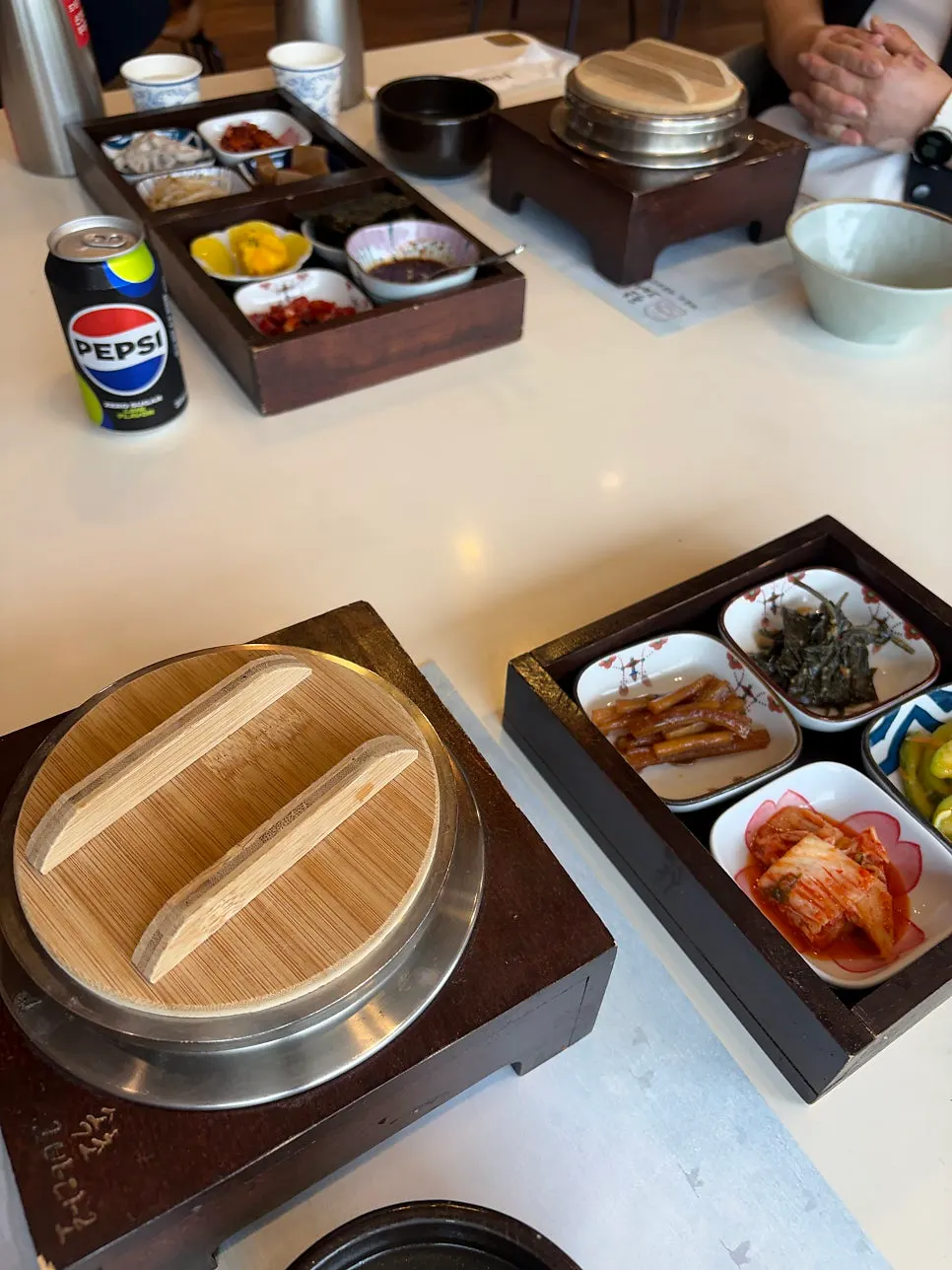 Table set with potato hot pot rice and side dishes served first