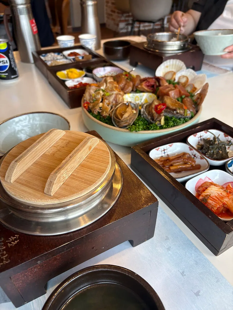 Lid opened on the steaming potato hot pot rice