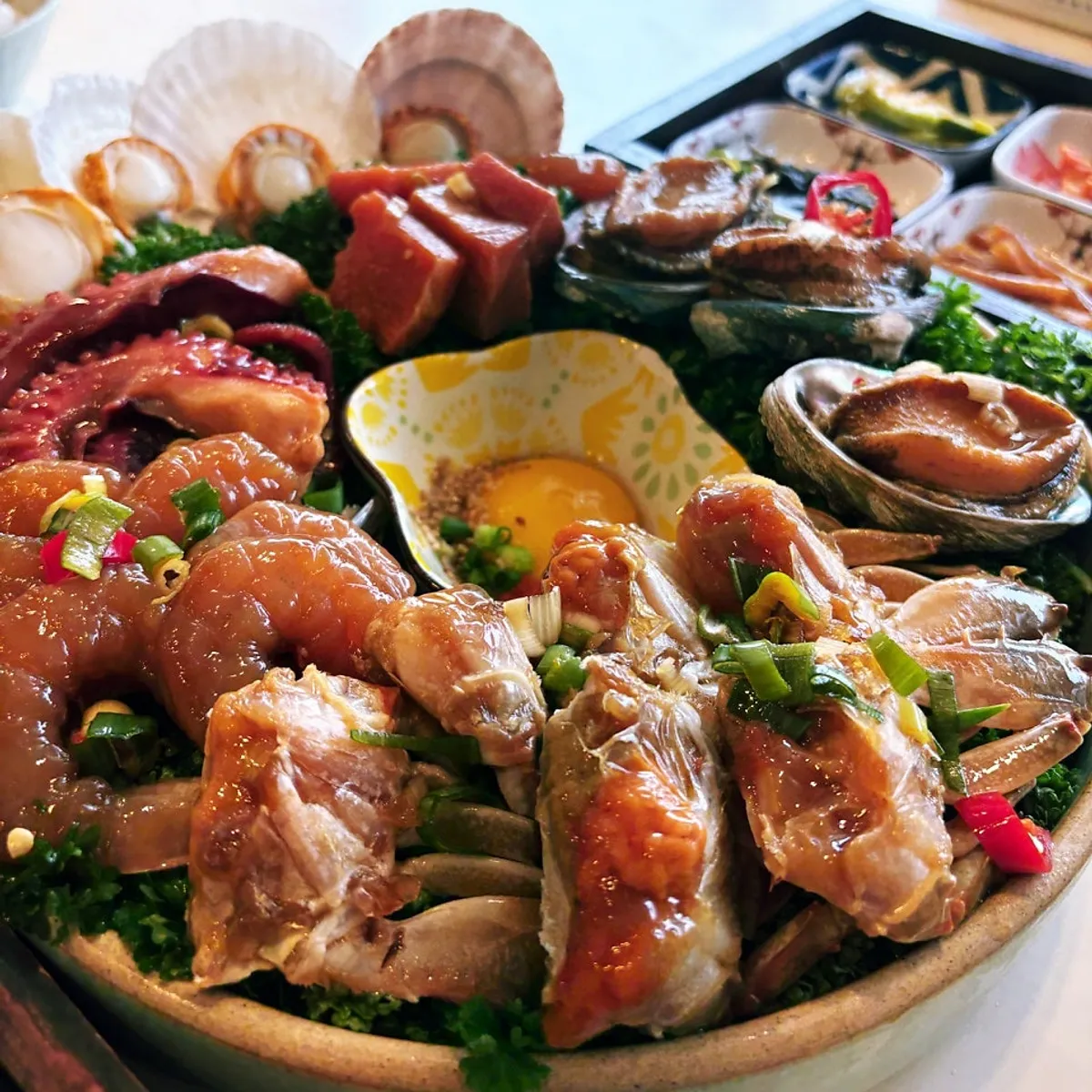 Assorted seafood jang with soy sauce crab, abalone jang and shrimp jang