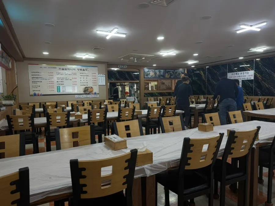 Spacious dining hall at Jinsol Halmeoni Sundubu with a baby chair