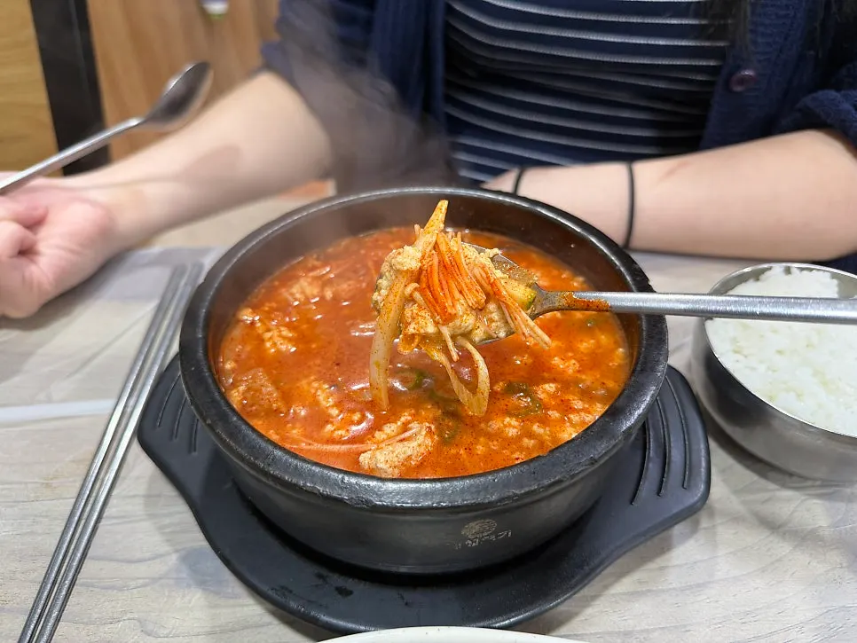 Mushrooms and other ingredients in the spicy sundubu