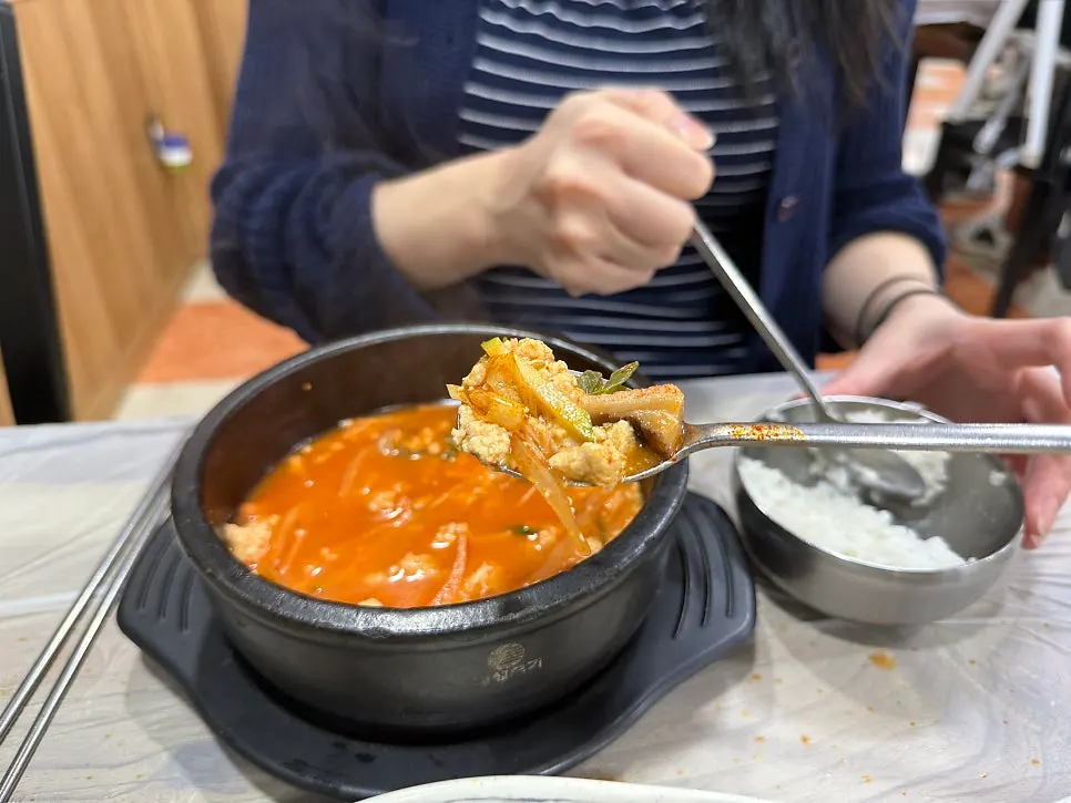 Rich broth of the spicy sundubu