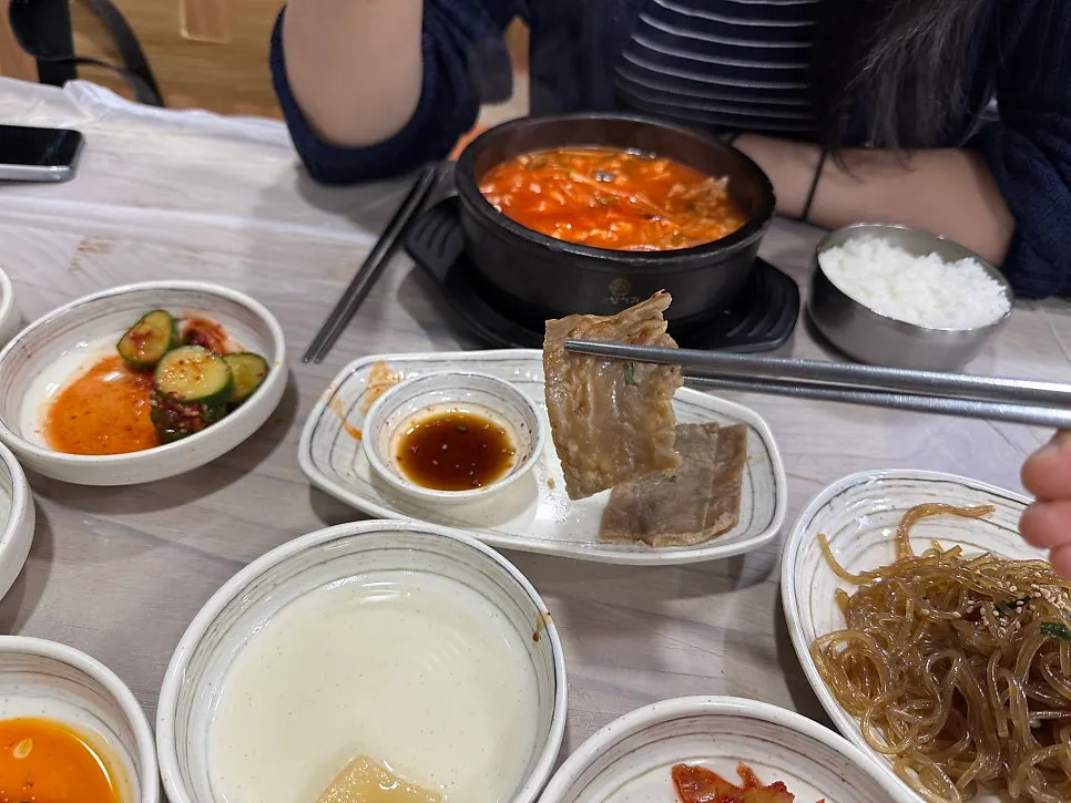 Buckwheat pancake, cucumber salad, and other banchan