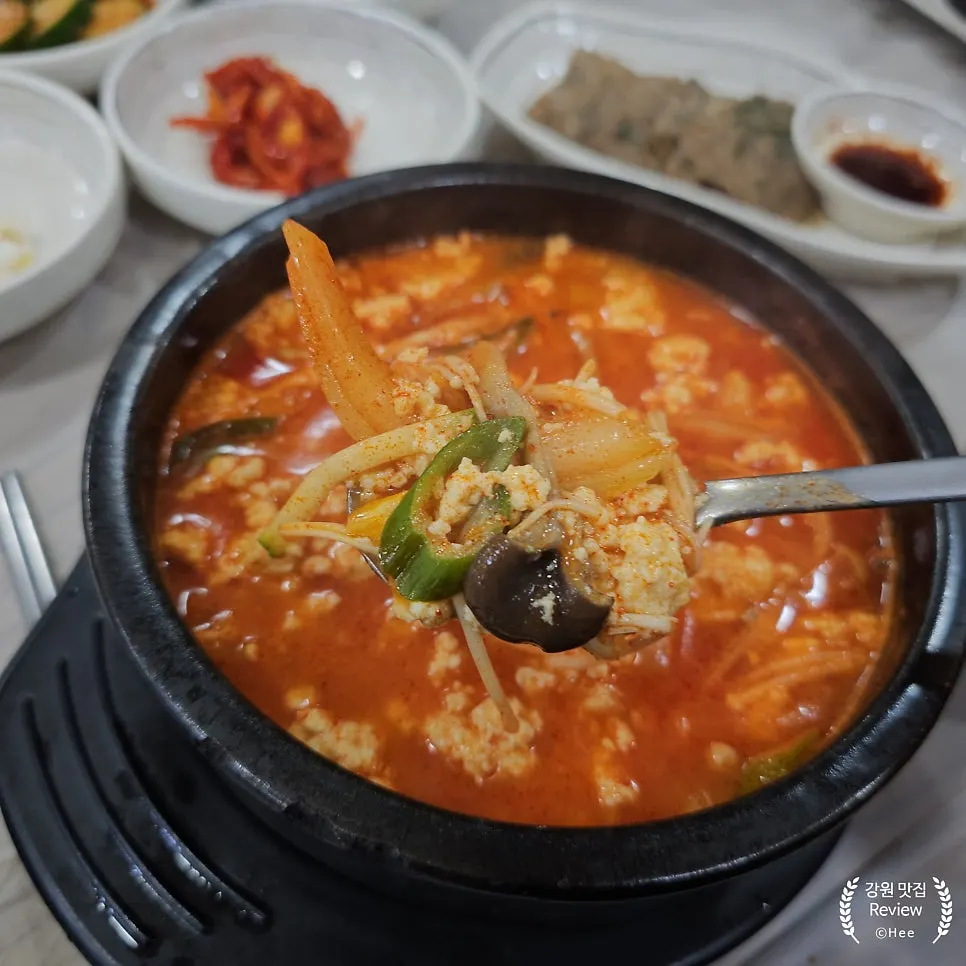 Warm sundubu with a bowl of rice
