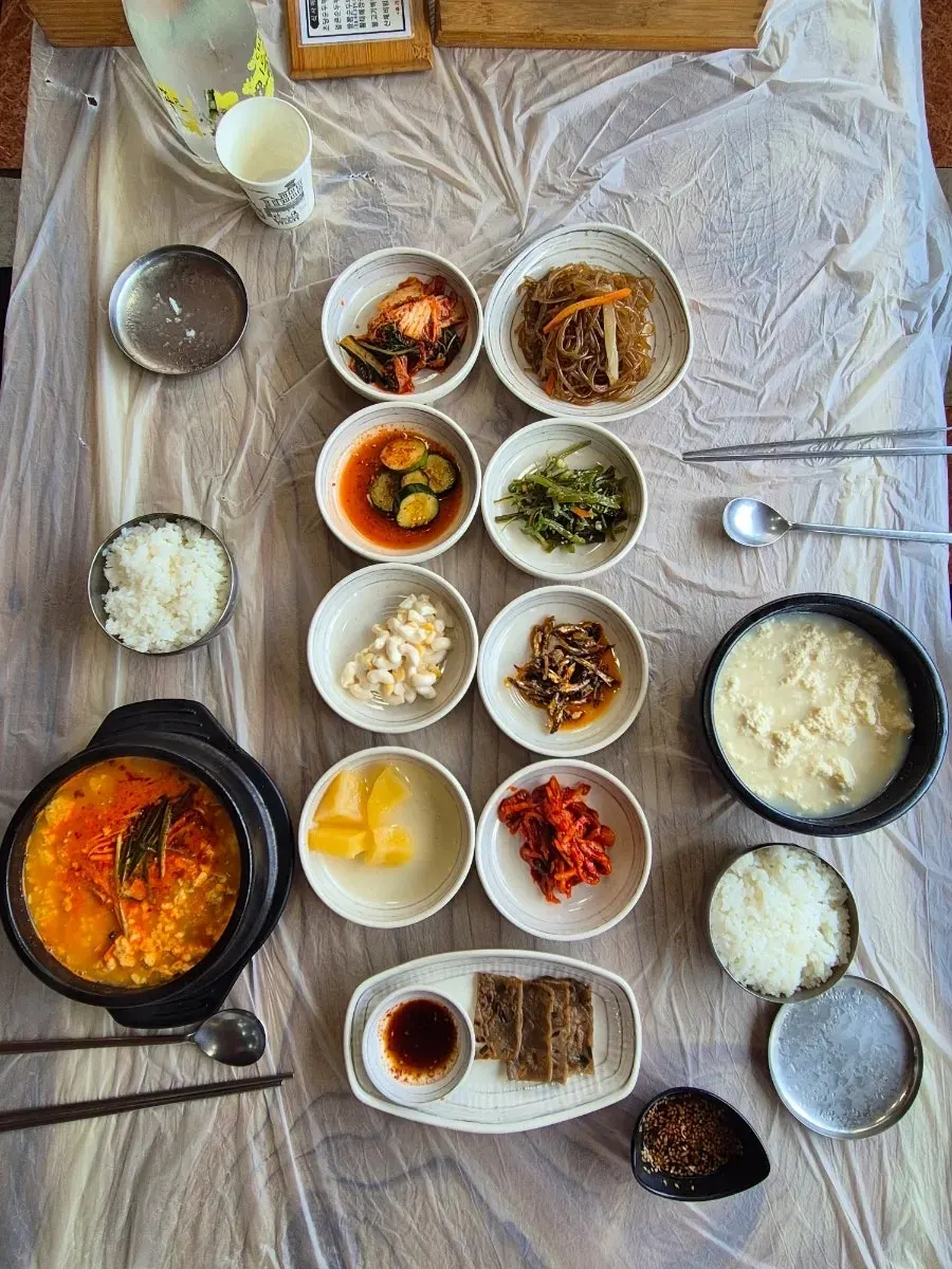 Table spread with Chodang sundubu and jjamppong seafood sundubu