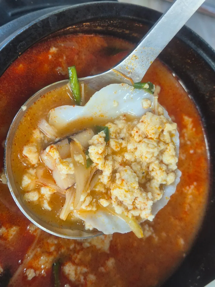 Stone pot of jjamppong seafood sundubu loaded with seafood