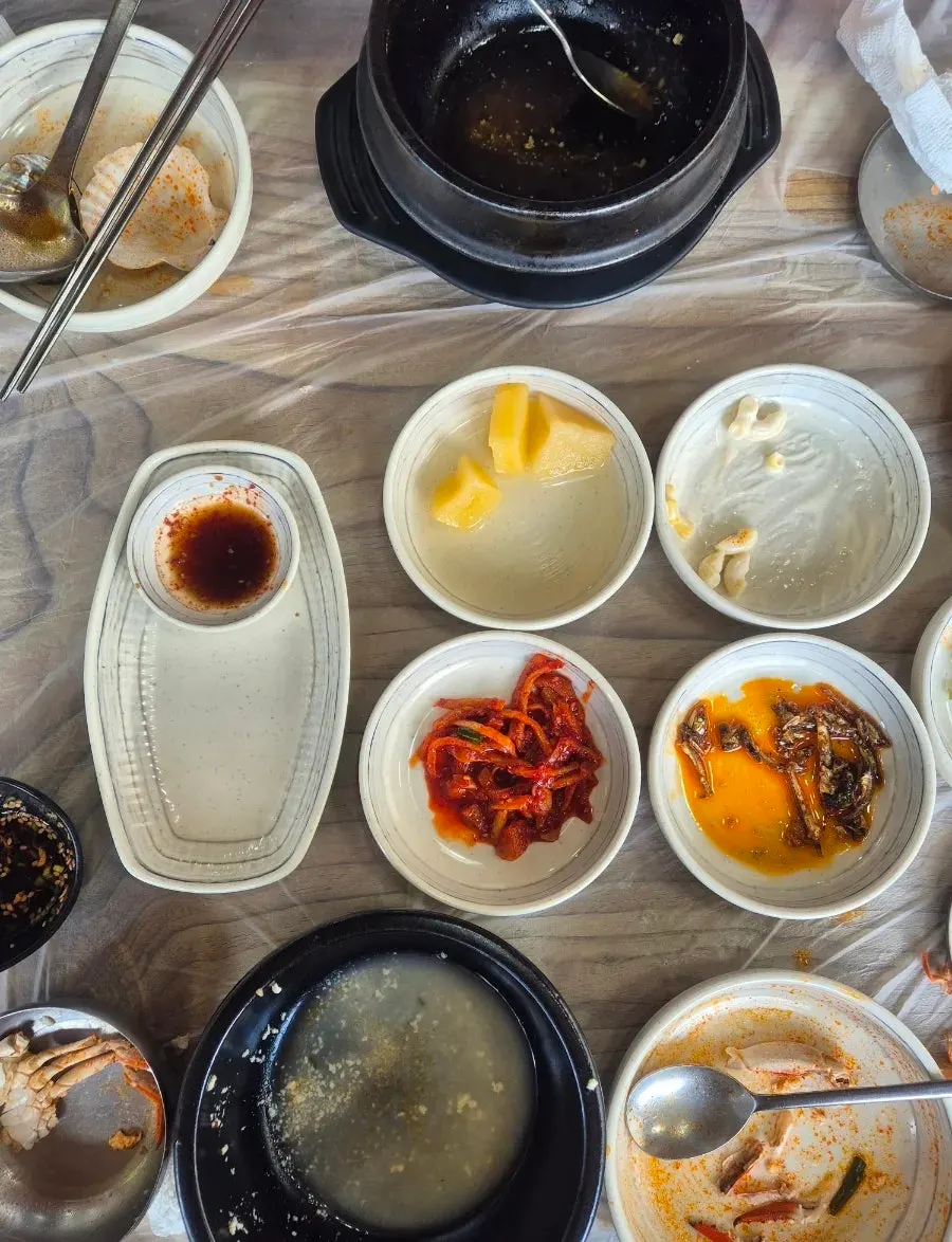 Empty sundubu bowls and side dish plates