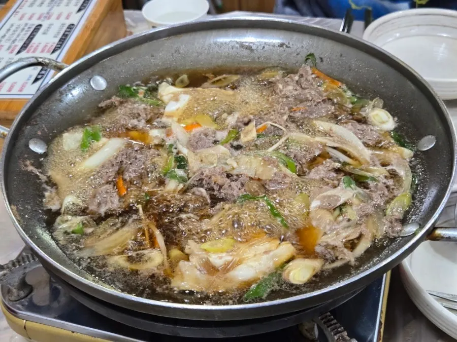 Bulgogi baekban simmering on the burner