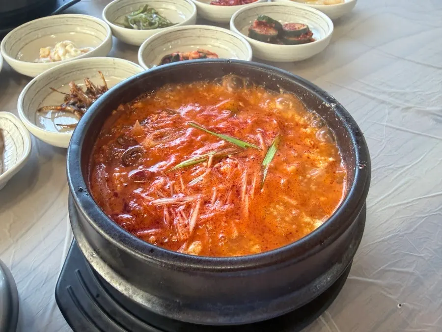 Table set with jjamppong seafood sundubu and hwangtae haejangguk