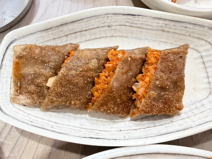 A table packed with various banchan