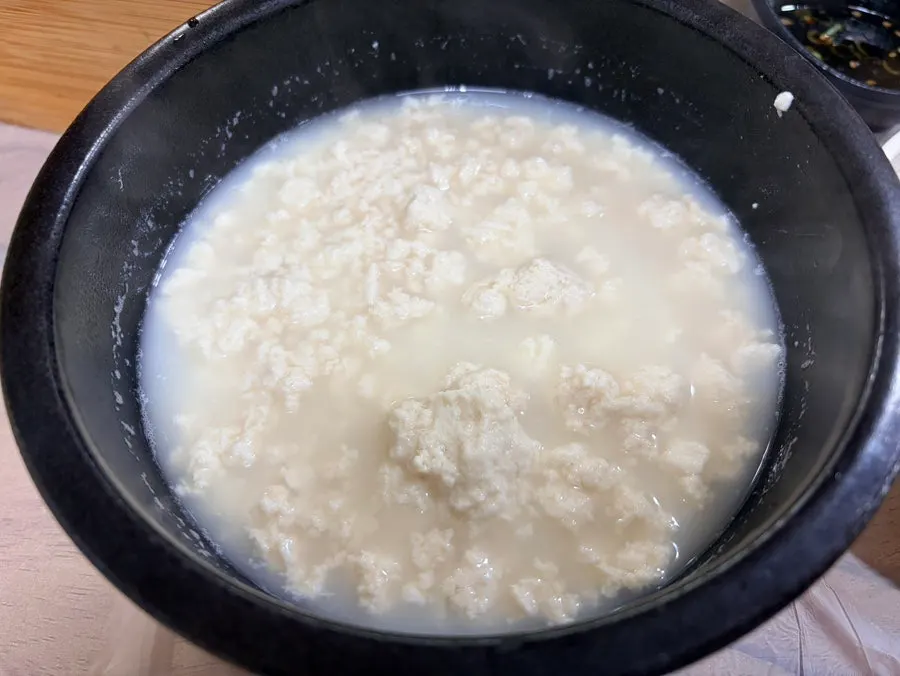 Sundubu stew served in a stone pot