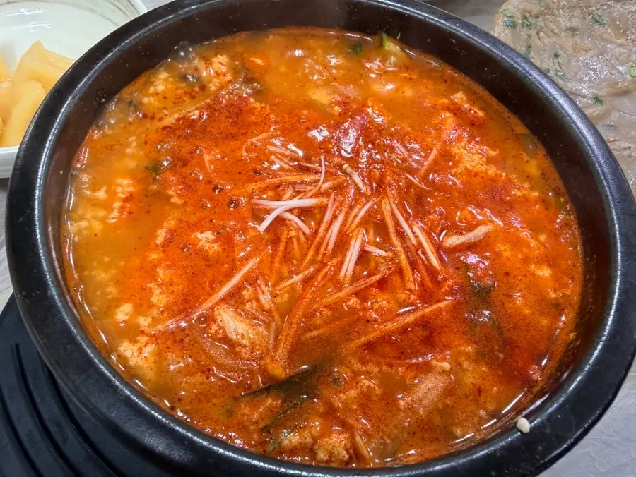 Jjamppong sundubu stone pot with chili oil swirled in