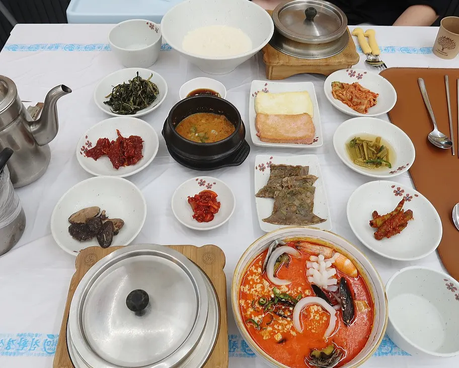 Menu board listing sundubu and pollack dishes