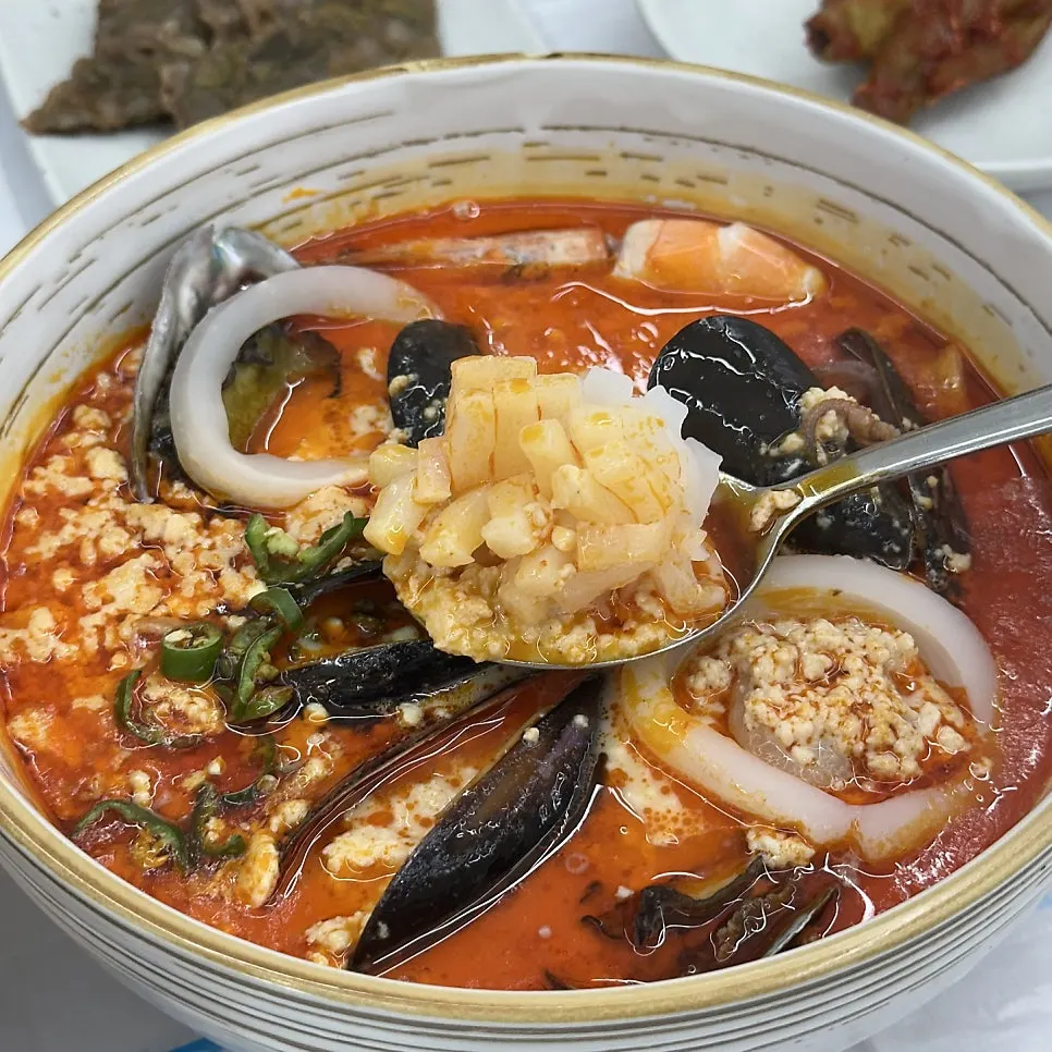 Abalone jjamppong sundubu topped with seafood