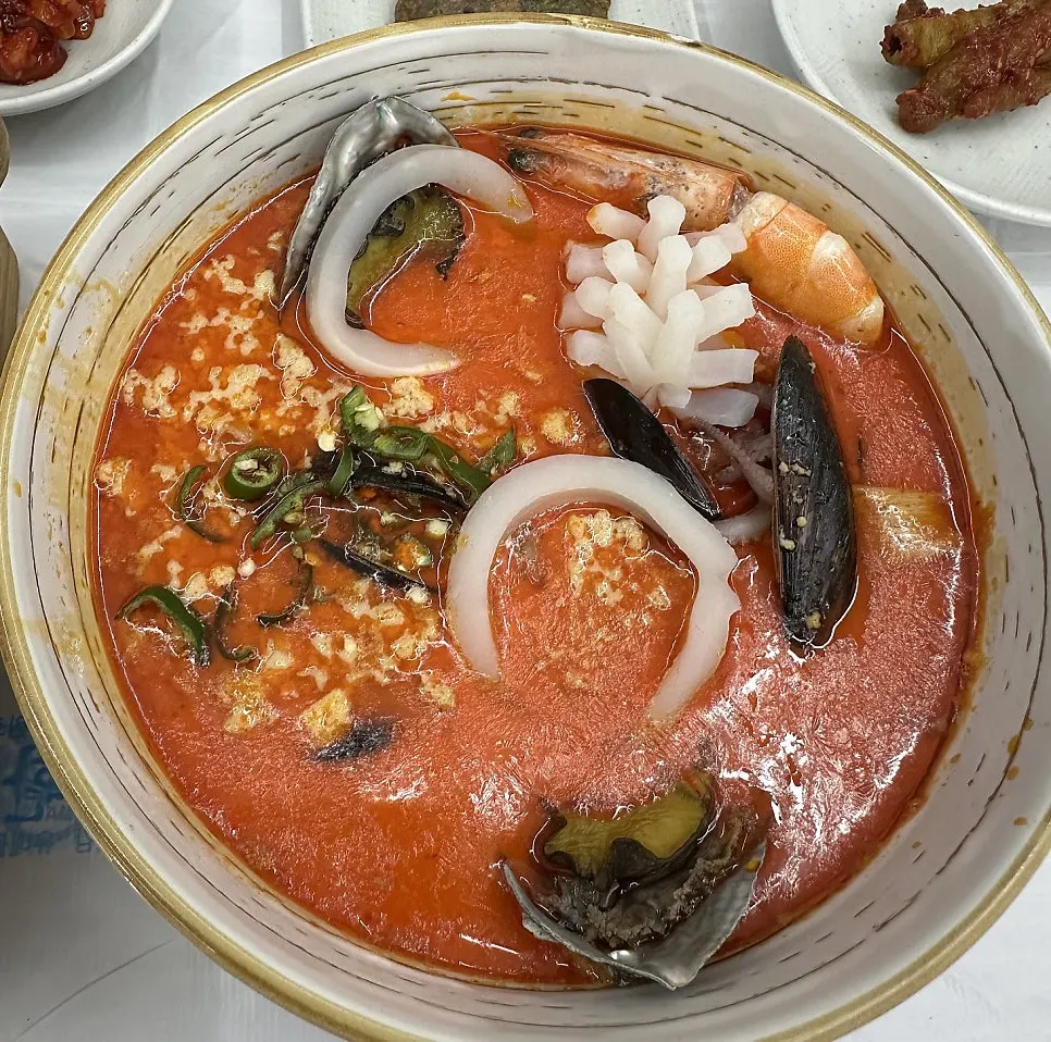 Two bowls: chodang sundubu and abalone jjamppong sundubu