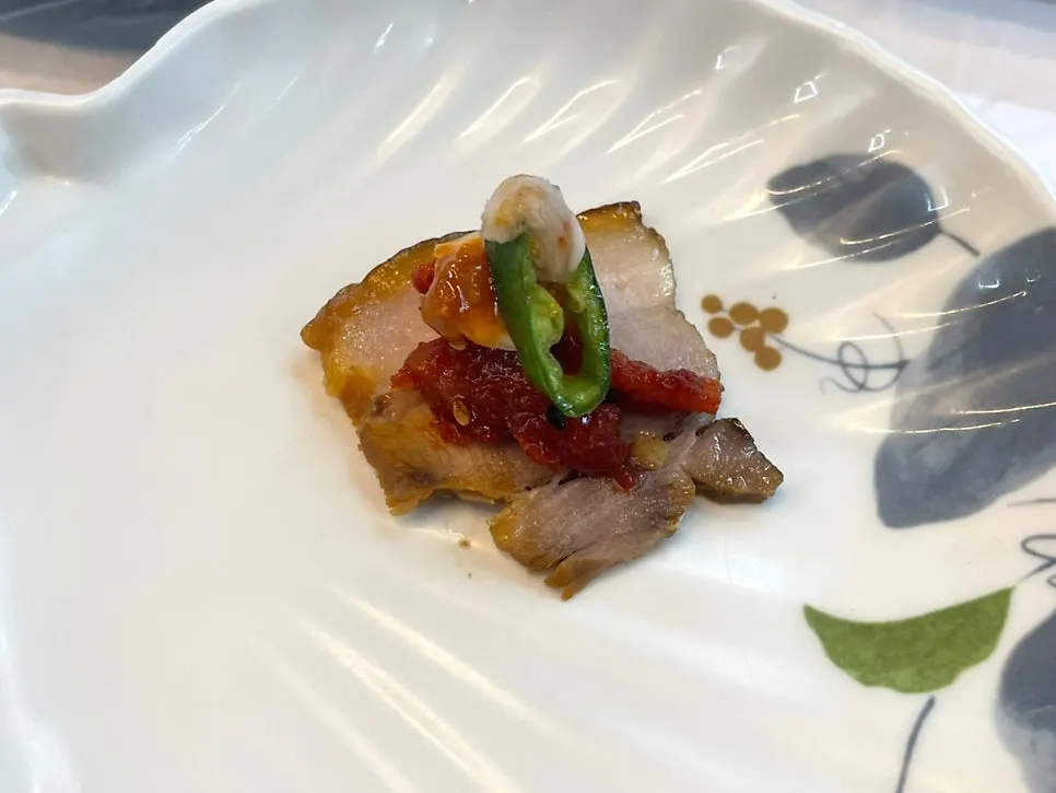 Suyuk served with dried radish strips and pollack sashimi salad