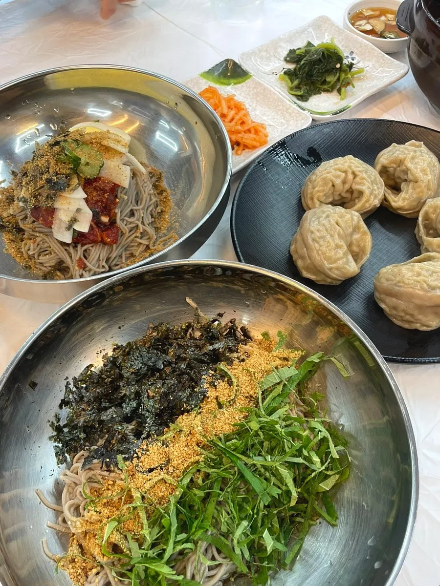 Buckwheat king mandu torn open, juices visible