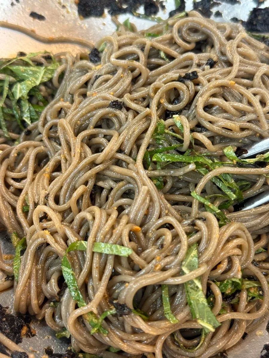 Self-made deulmemak topped with seaweed flakes and perilla leaf
