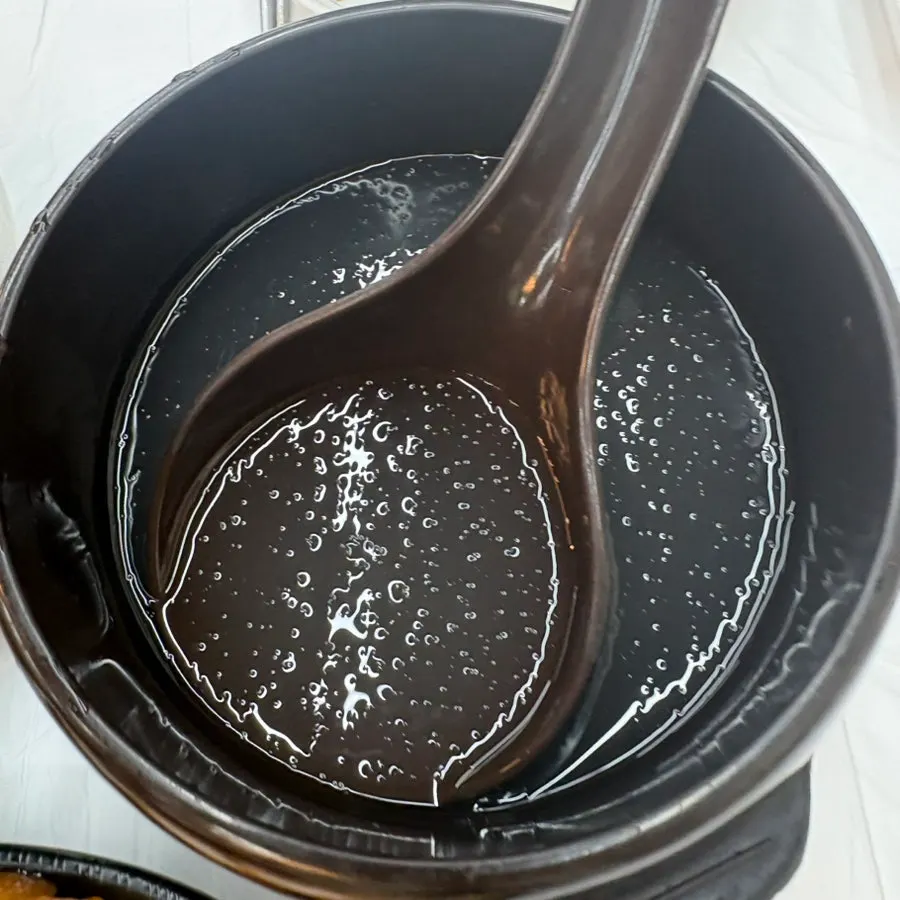 A bite of deulmemak mixed with dongchimi broth