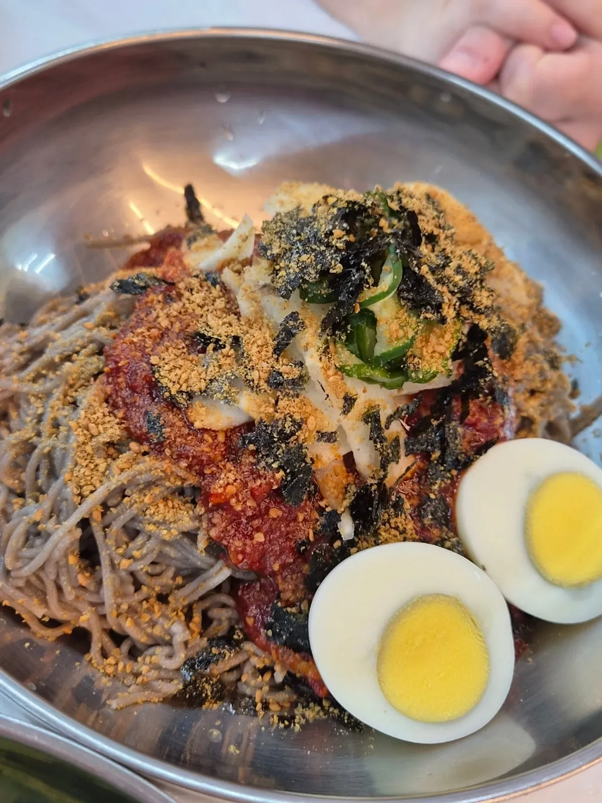 Pollack sashimi makguksu topped with chewy pollack sashimi