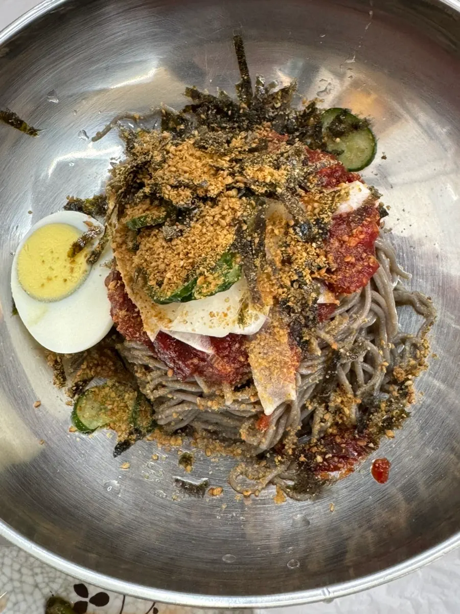 A bowl of deulmemak with a subtle perilla leaf aroma