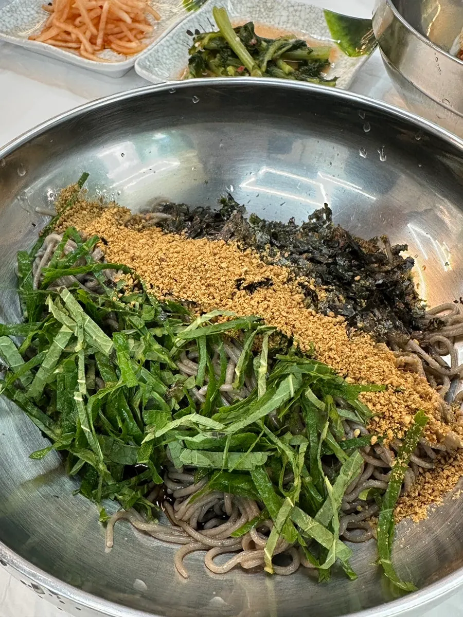 A bowl of signature perilla oil buckwheat makguksu