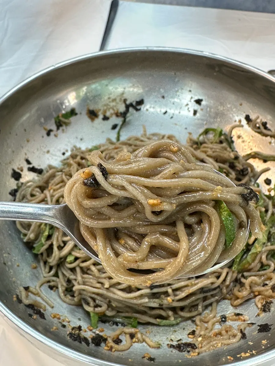 Buckwheat noodles lifted with chopsticks
