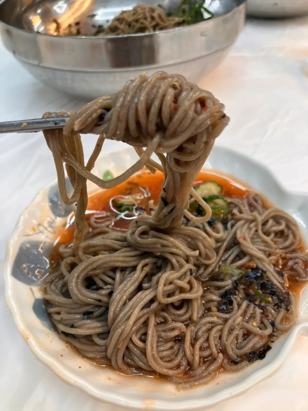 Perilla oil noodles, mul-makguksu and suyuk laid out together