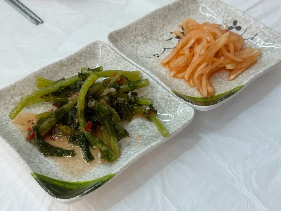 Side dishes of radish greens kimchi and radish salad