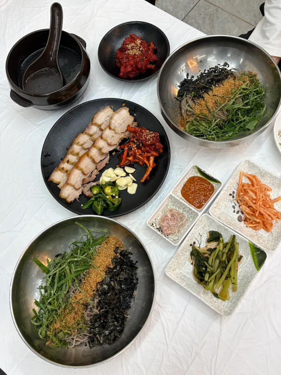 Full spread of two deulmemak, suyuk, and pollack salad