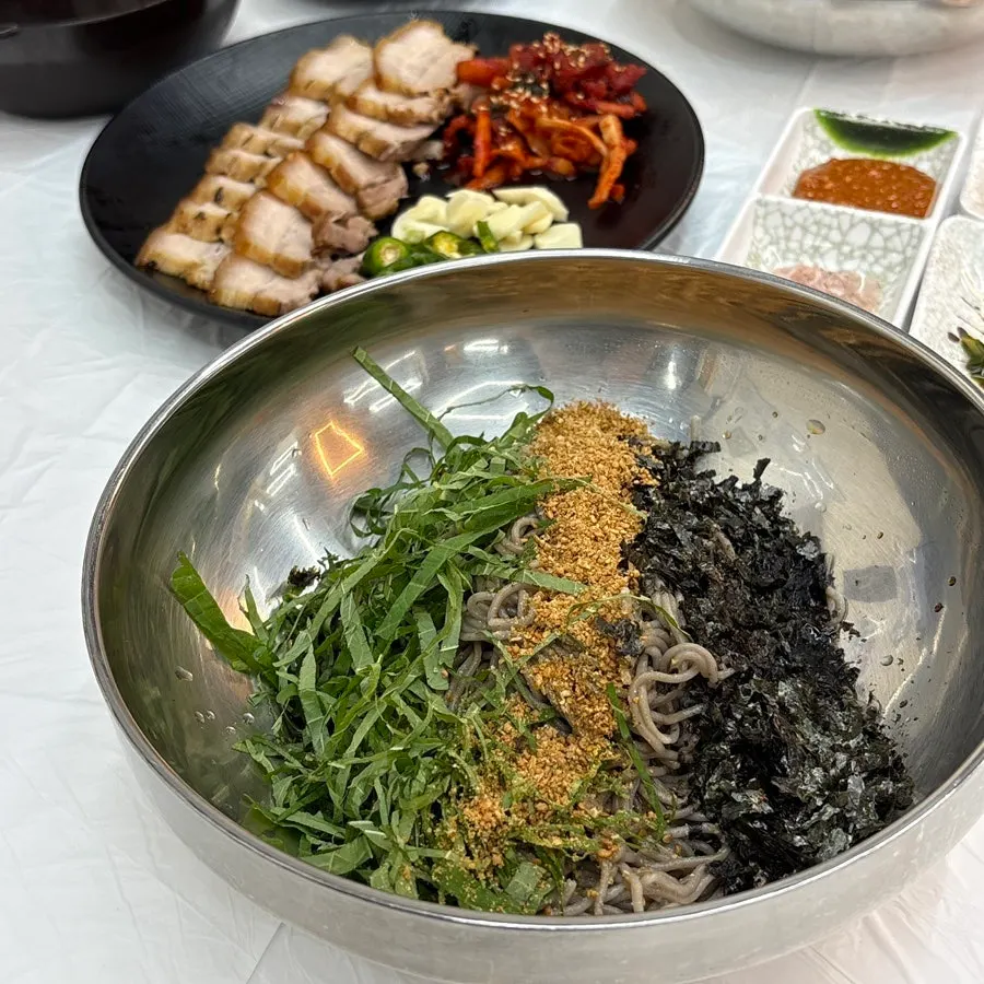 Perilla oil buckwheat makguksu with aroma rising from the bowl