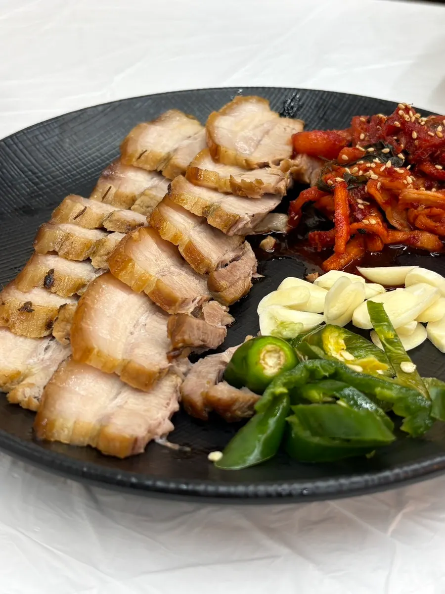 Wrapping suyuk with dried radish strips