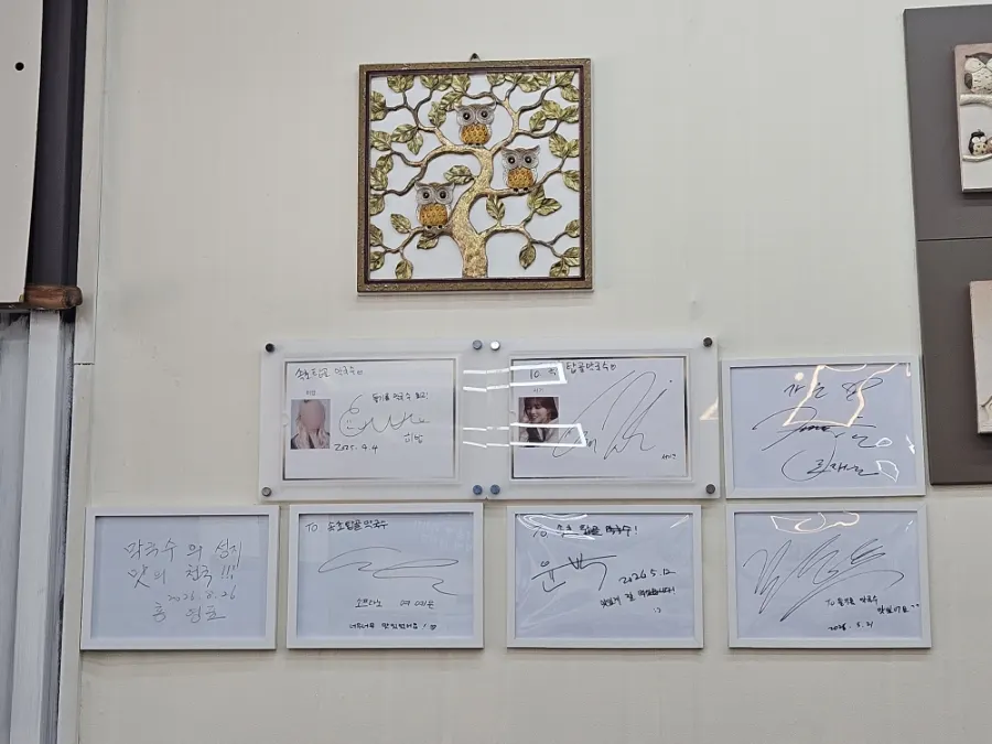 Photos of visiting celebrities displayed in the restaurant