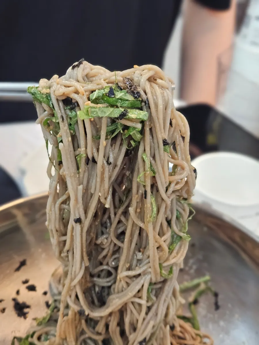 Buckwheat noodles lifted with chopsticks