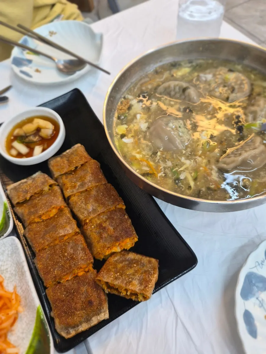 Buckwheat mandu-guk filled with dumplings and egg