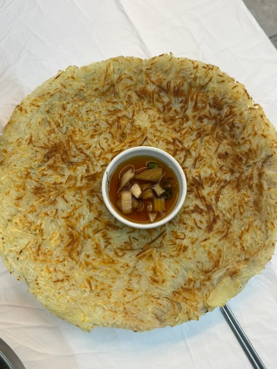 Potato pancake filling a wide plate