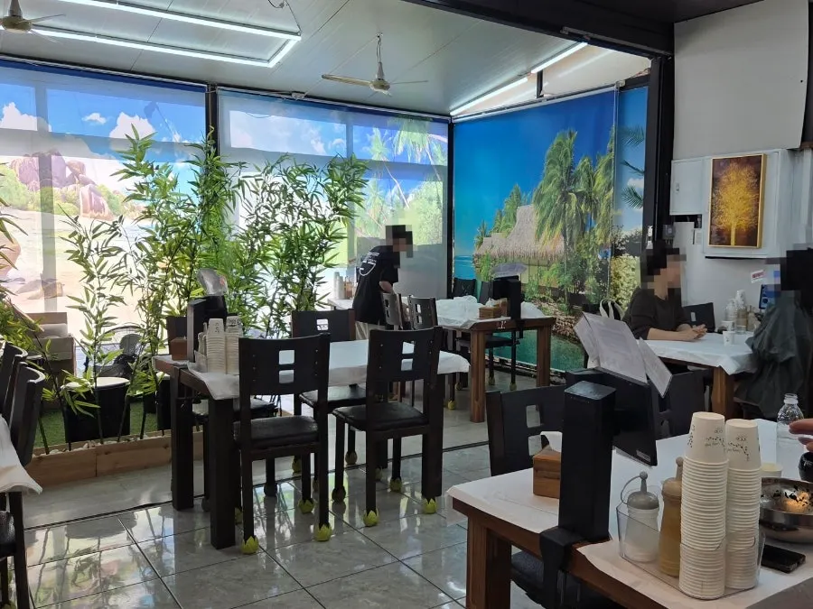 Dining hall with tables seating 4–6
