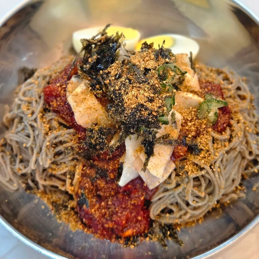 Large buckwheat makguksu topped with two egg halves