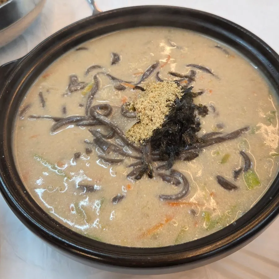 Buckwheat perilla kalguksu served in a large bowl