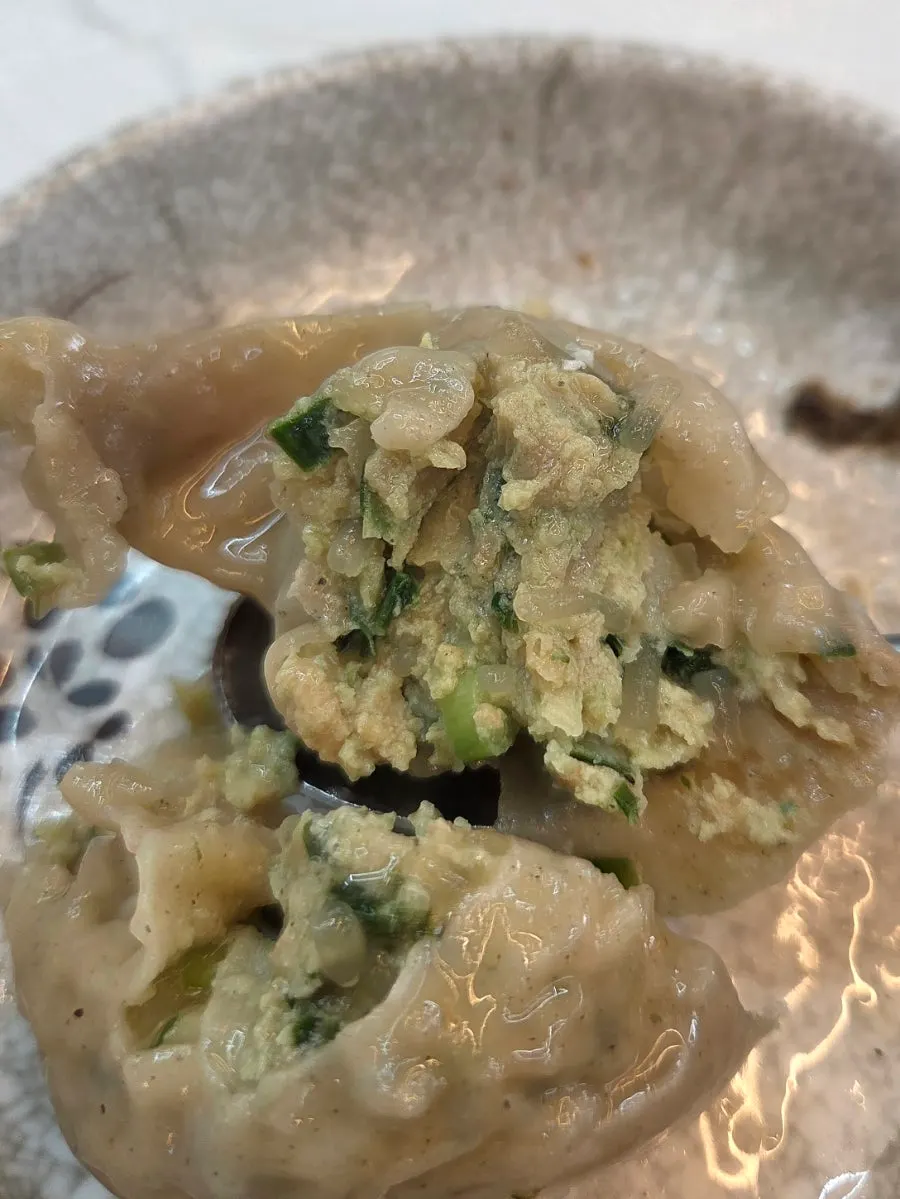 A single buckwheat king dumpling with a full filling