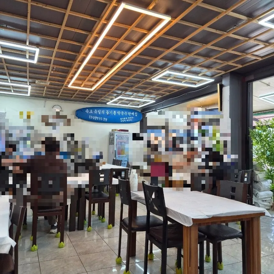 Clean restaurant interior with many tables