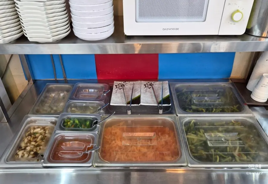 Mu-saengchae and yeolmu kimchi at the self-serve bar