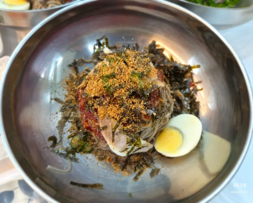 Buckwheat makguksu topped with seasoning sauce