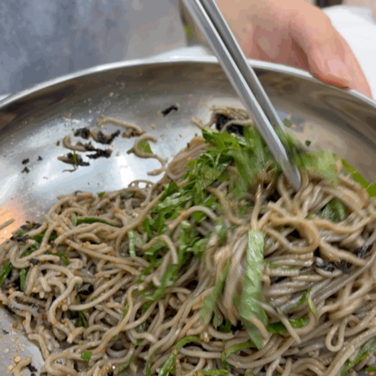Close-up of mixed deulmemak buckwheat noodles