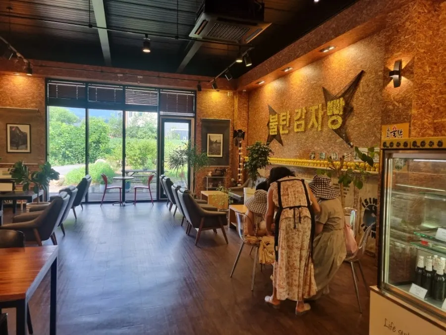 Café interior with a view through the floor-to-ceiling windows