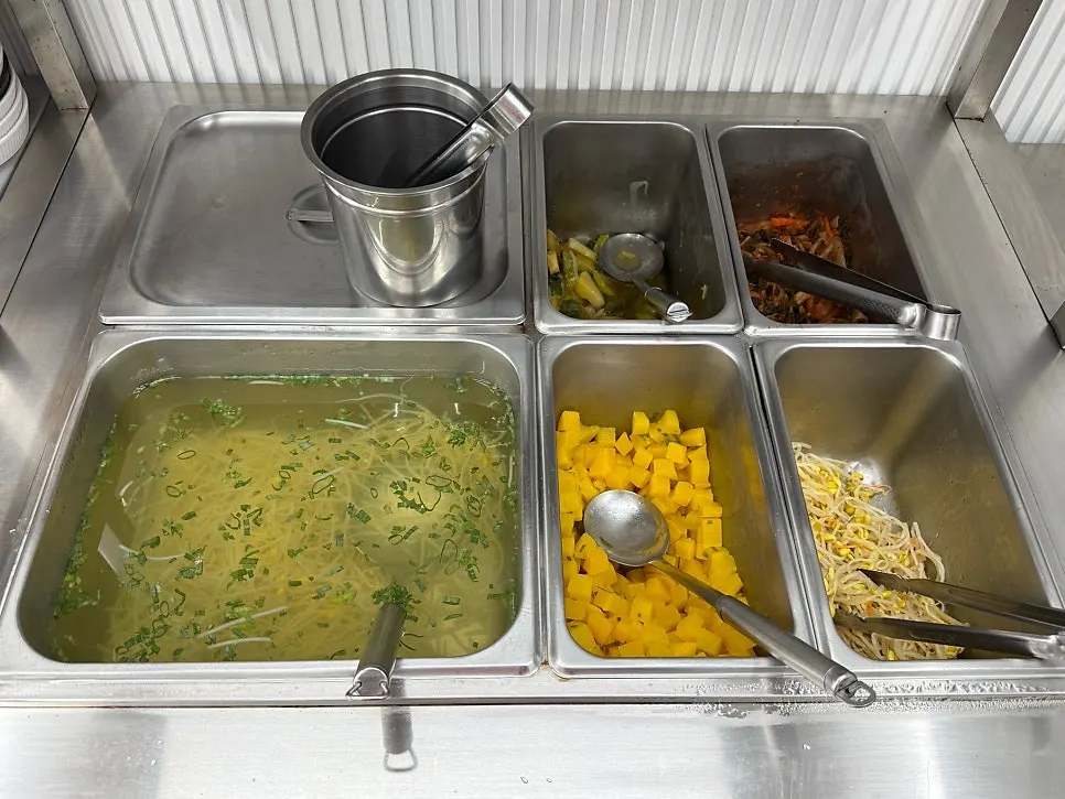 Self-serve side dish bar at Deungdae Gotgan
