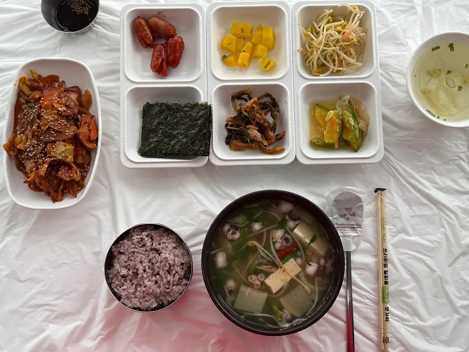 A breakfast spread of jeyuk bokkeum and nakji haejangguk