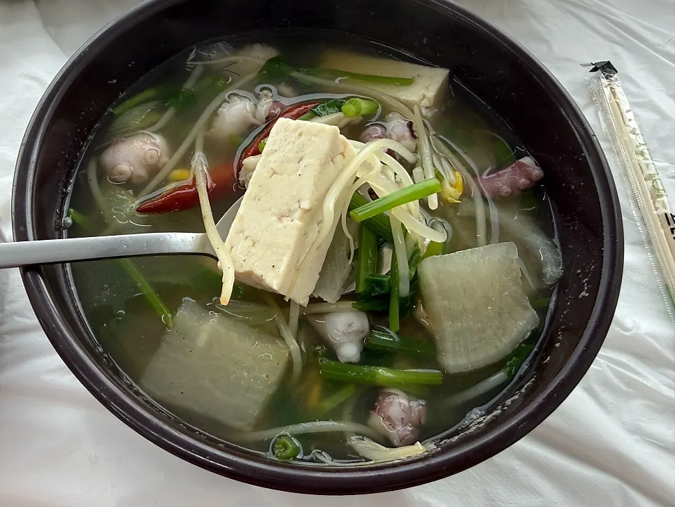 Close-up of the clear broth in the nakji haejangguk